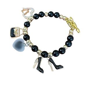 New handcrafted shopping themed bracelet combines blackbeads & goldaccents
